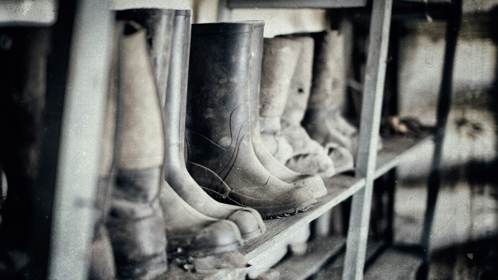 Wellington boots by the door in autumn, the kind of mud the best cordless vacuum under £250 has to deal with