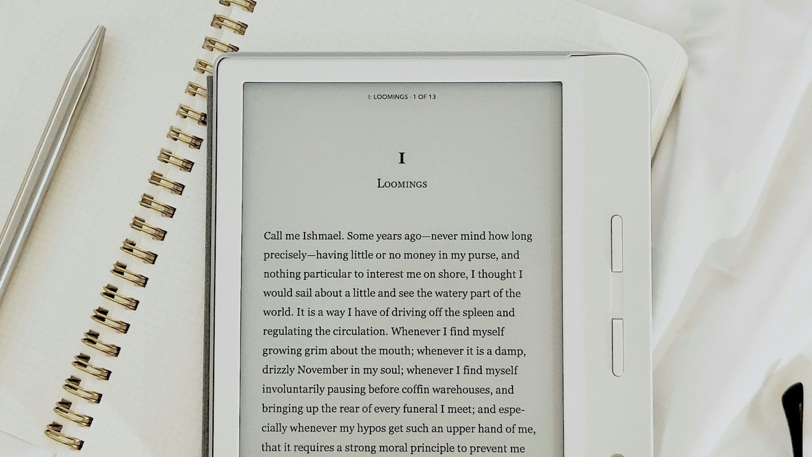 A white e-reader showing the opening page of Moby-Dick on a notebook, the best e-reader under £100 for dark evenings