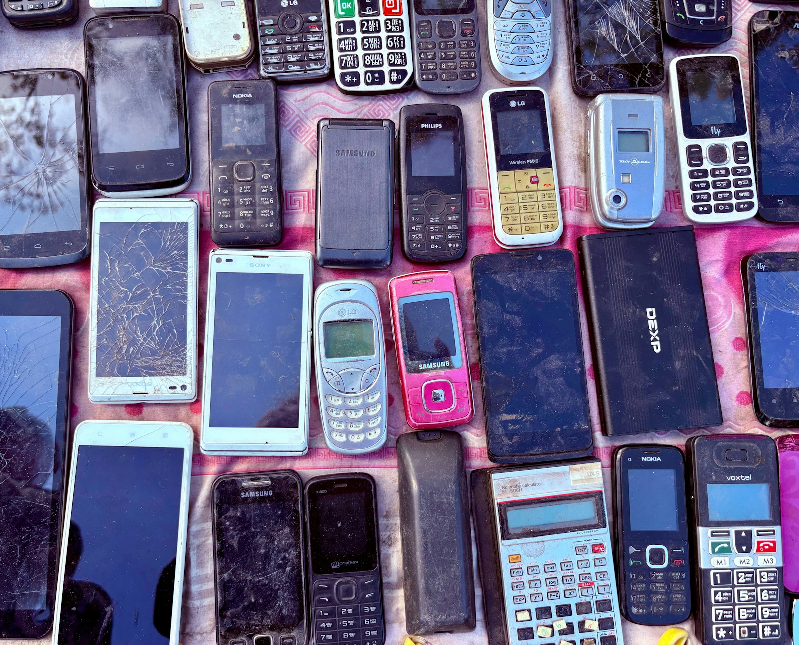 A pile of old 2G and 3G mobile phones - many cheap brick phones on Amazon no longer work on Three's network