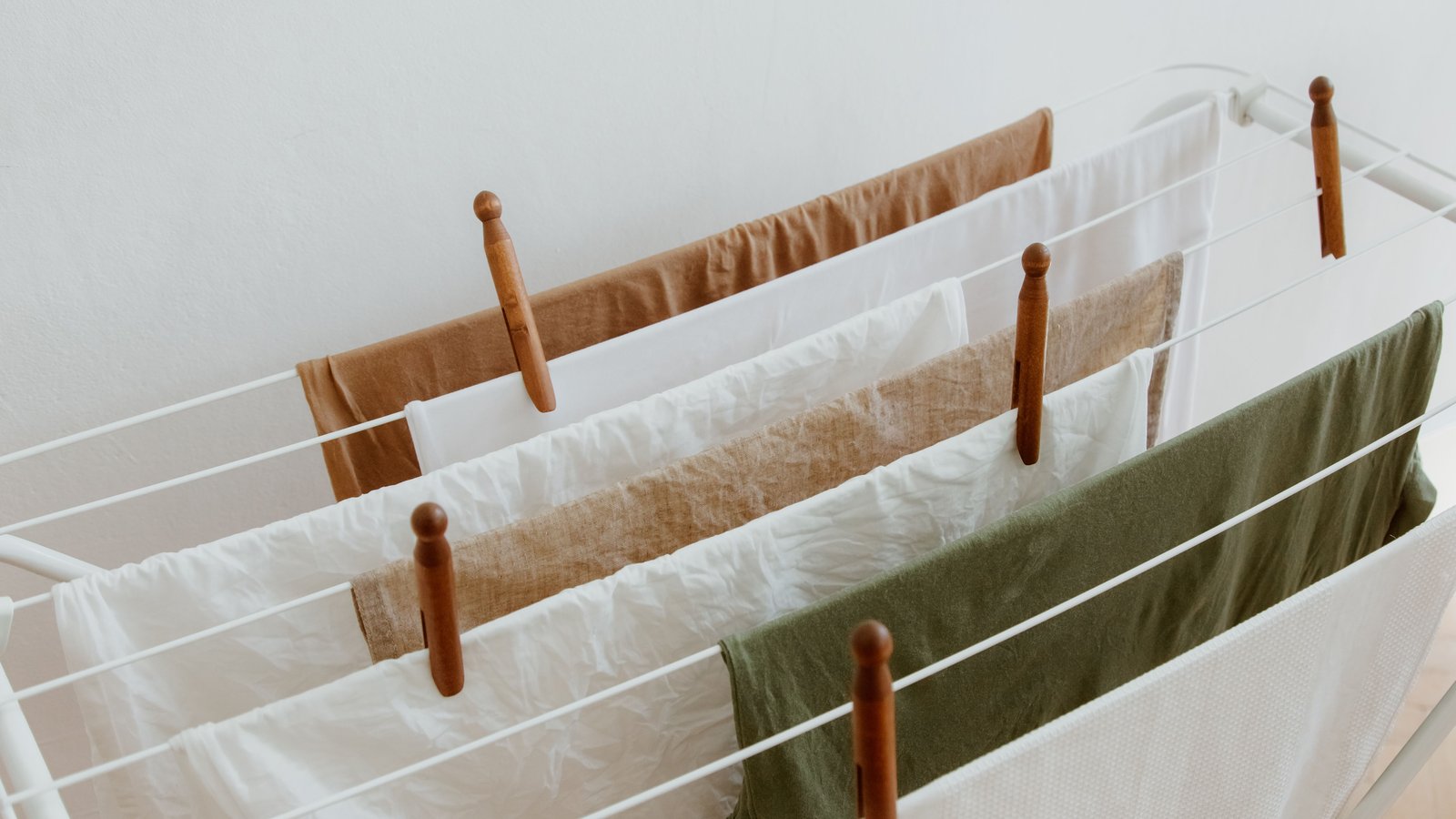 best heated clothes airer under £100 - three-tier heated airer with laundry drying indoors