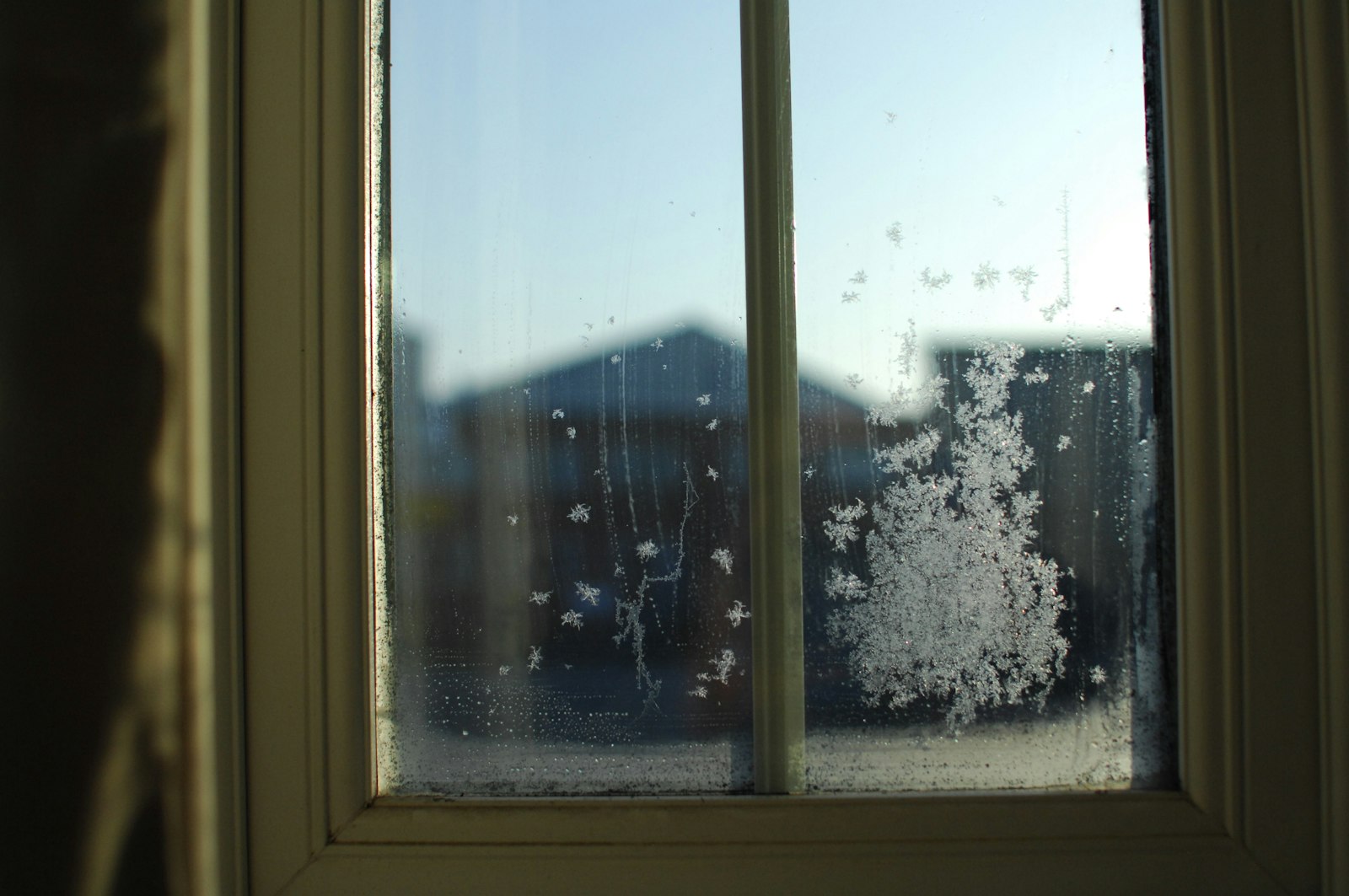 Dark window on a British winter morning before sunrise