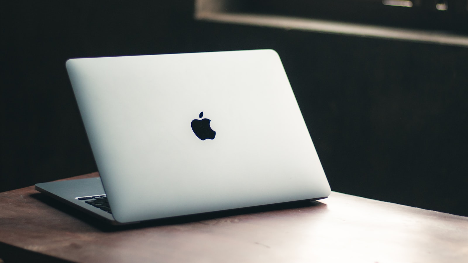 Apple MacBook on a wooden desk - the £499 education-price MacBook Neo has reshaped the best student laptop under £500 debate
