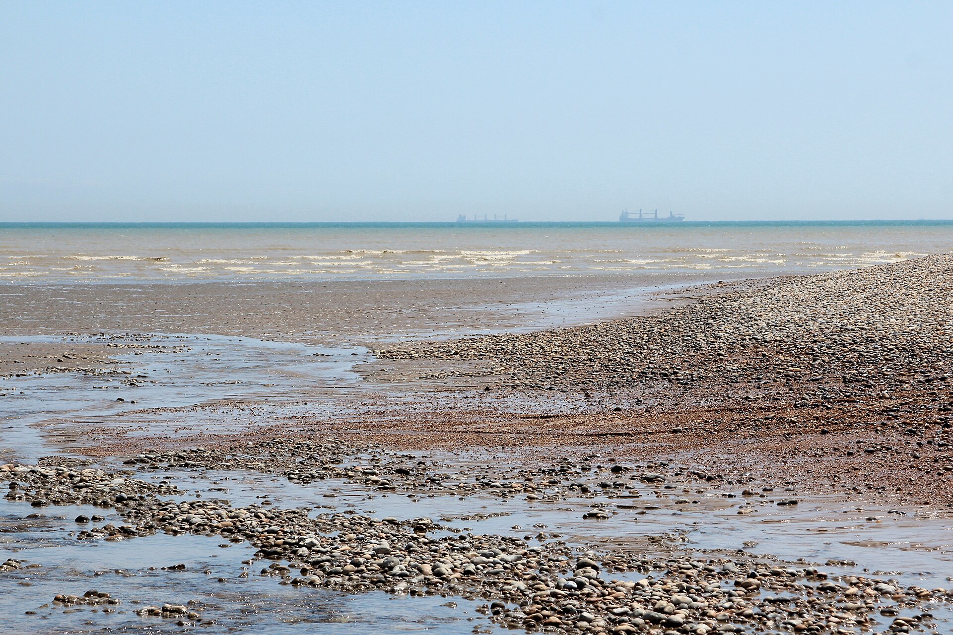 Shingle beach at Dungeness on the Kent coast, the kind of coast behind M. John Harrison's The End of Everything