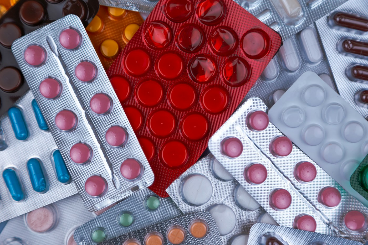Pile of colourful antibiotic and medicine blister packs - the strongest evidence for probiotics is preventing antibiotic-associated diarrhoea