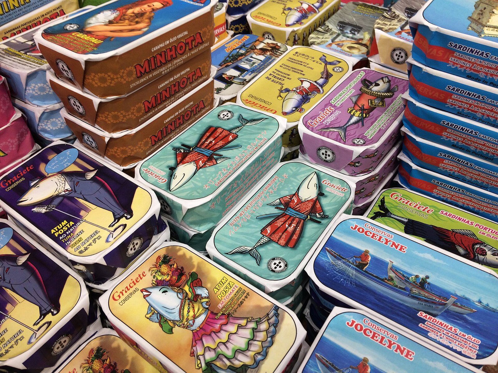 Stacked tins of Portuguese sardines in colourful packaging