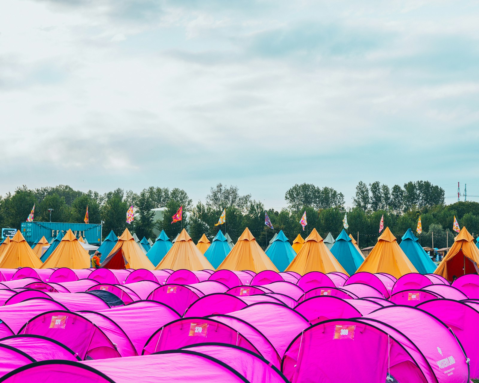 Rows of tents at a festival campsite in summer