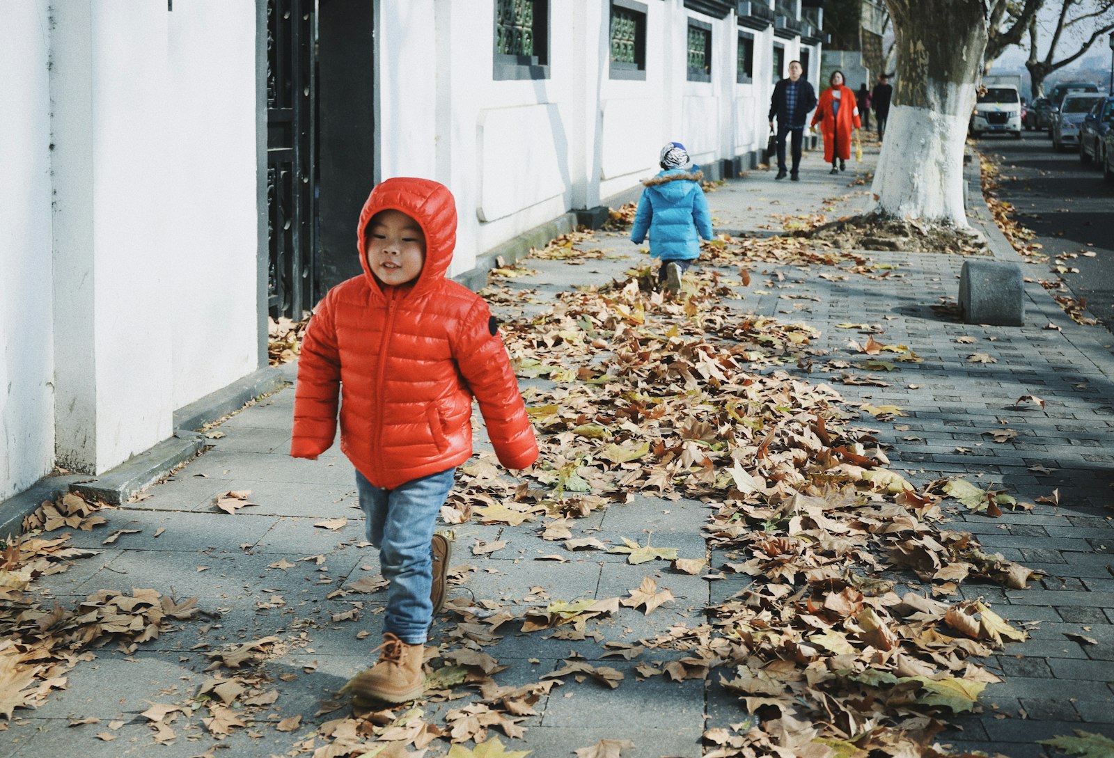 Children walking to school along a street - the September return that kicks off Britain's cold season