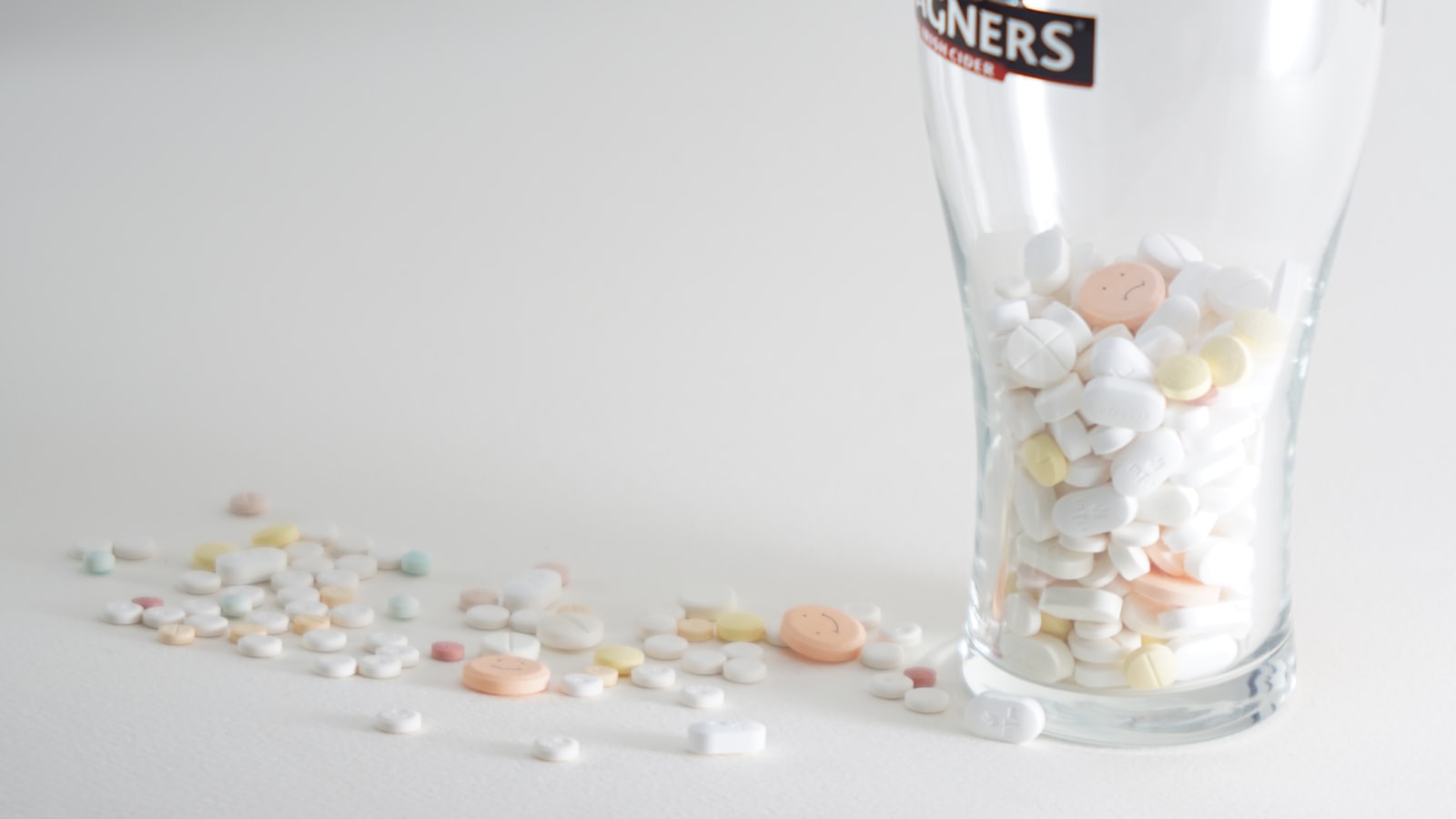 Assorted pills in a glass - immune boosting supplements promise more than the trial evidence supports