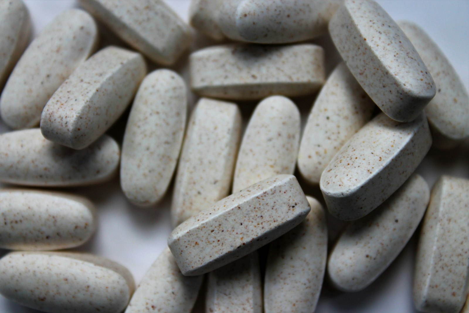 Close-up of white tablets - a 200mg ferrous sulfate tablet contains 65mg of elemental iron