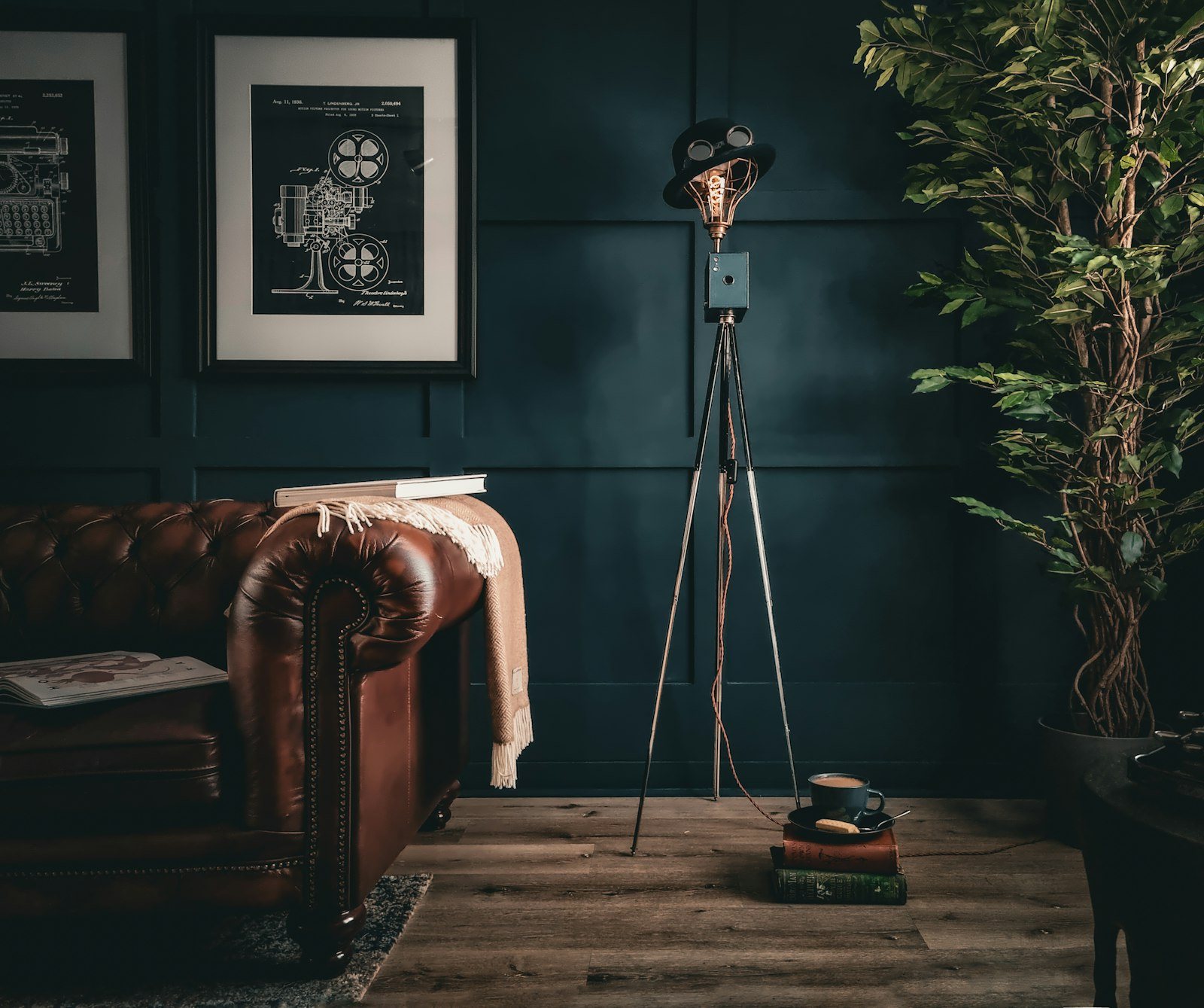 Living room lighting ideas: a leather sofa lit by a single tripod floor lamp instead of the big light