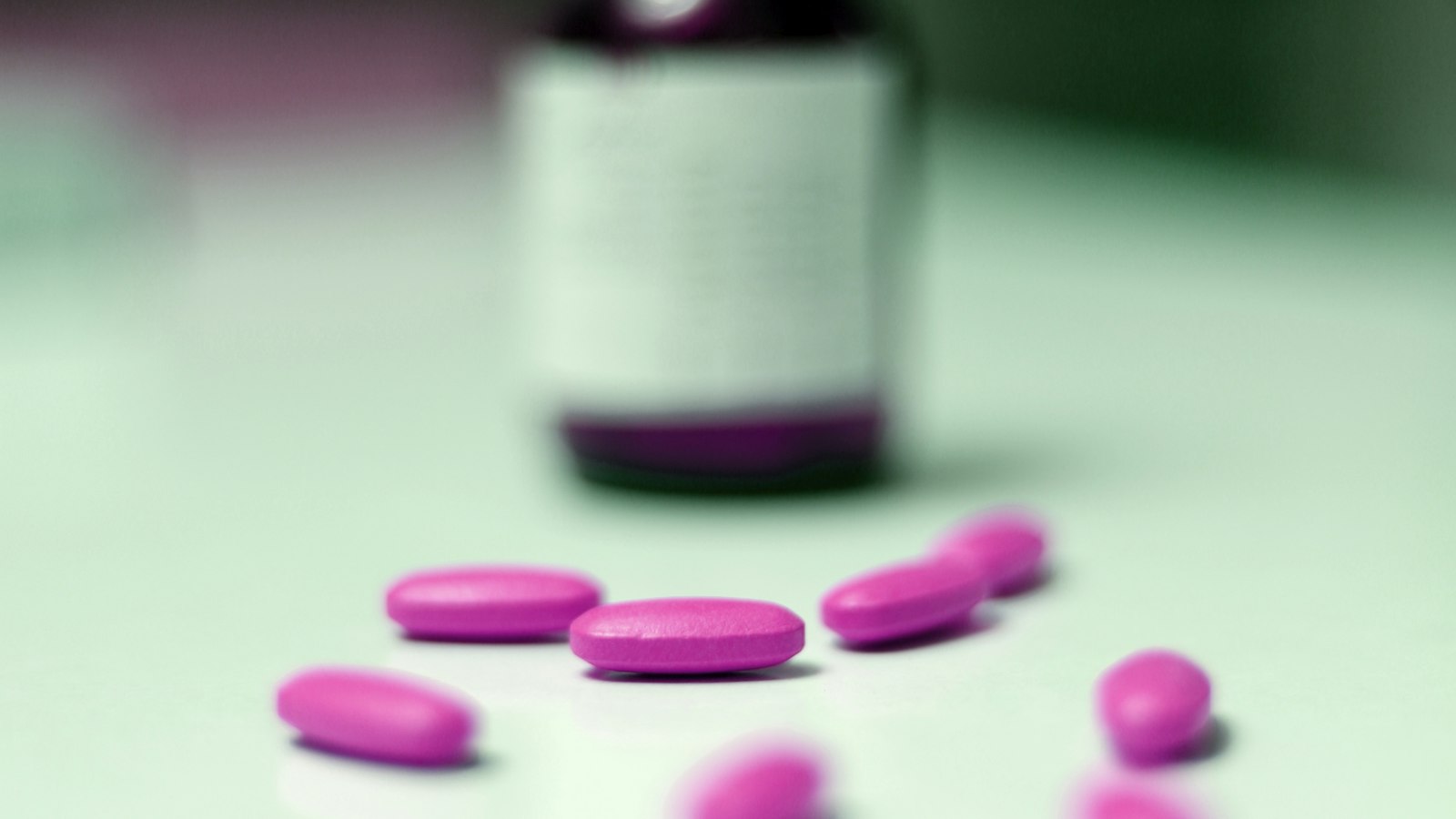 A bottle of prescription tablets on a table - in the UK, melatonin is only legally available this way, not as melatonin gummies