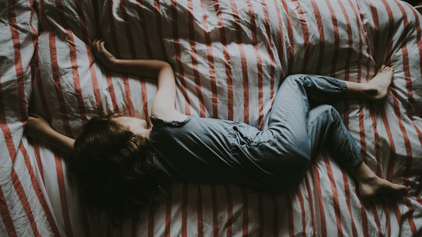 A child asleep in bed - over 117,000 under-18s in England were prescribed melatonin in a single quarter