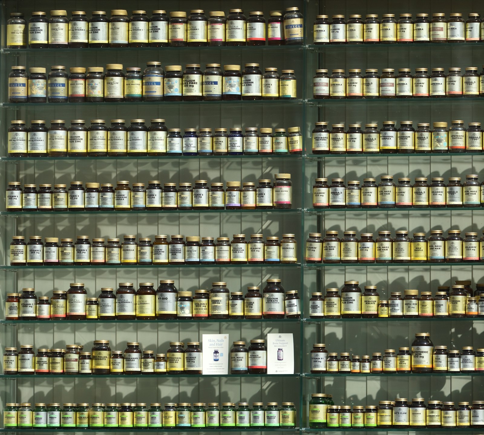 Shelves of supplement bottles in a health shop, the kind of aisle where menopause supplements now run to more than 200 products