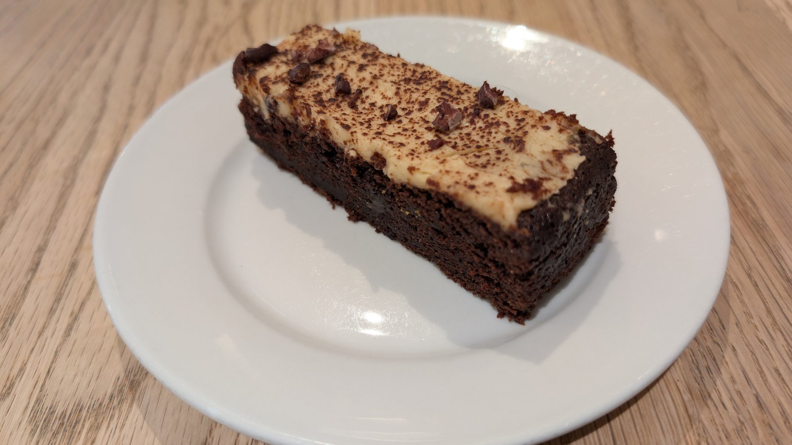 A slice of chocolate stout cake on a plate, the signature bake from the Nigella Lawson Bake Off 2026 opening episode