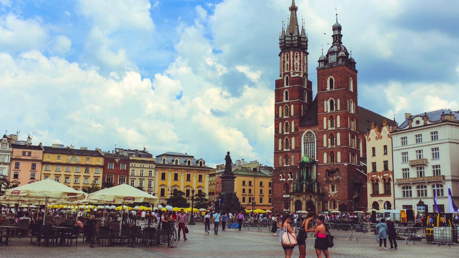 Market stalls and canopies in Krakow's Old Town square, a city break that costs less during October half term