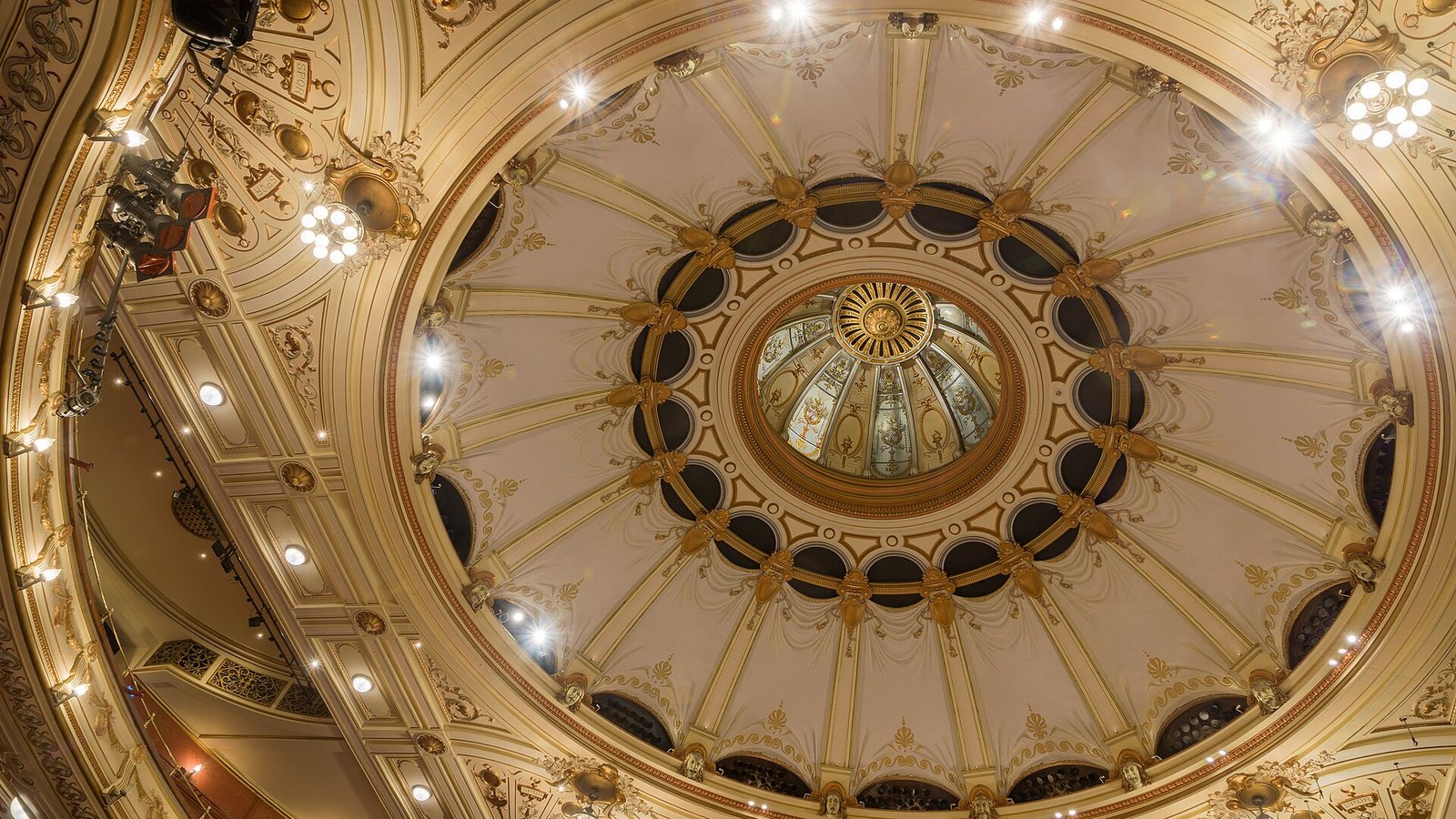 The painted ceiling and chandelier of the London Coliseum auditorium