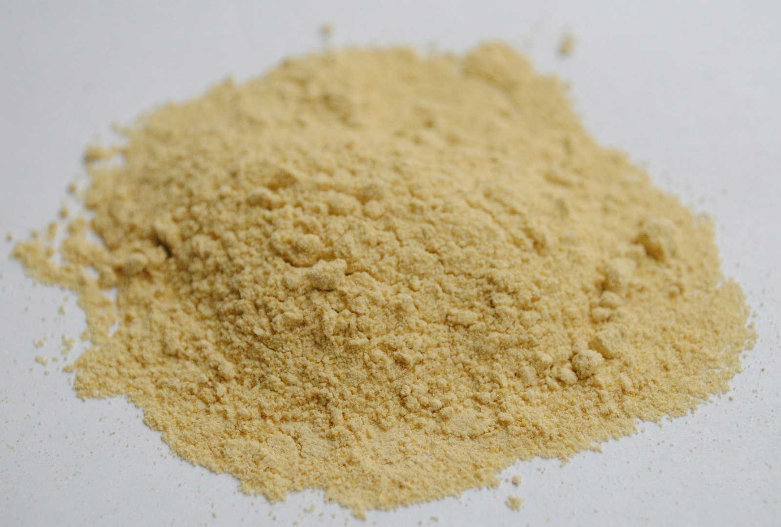 Pile of pale herbal root powder, the form in which ashwagandha for stress is often sold