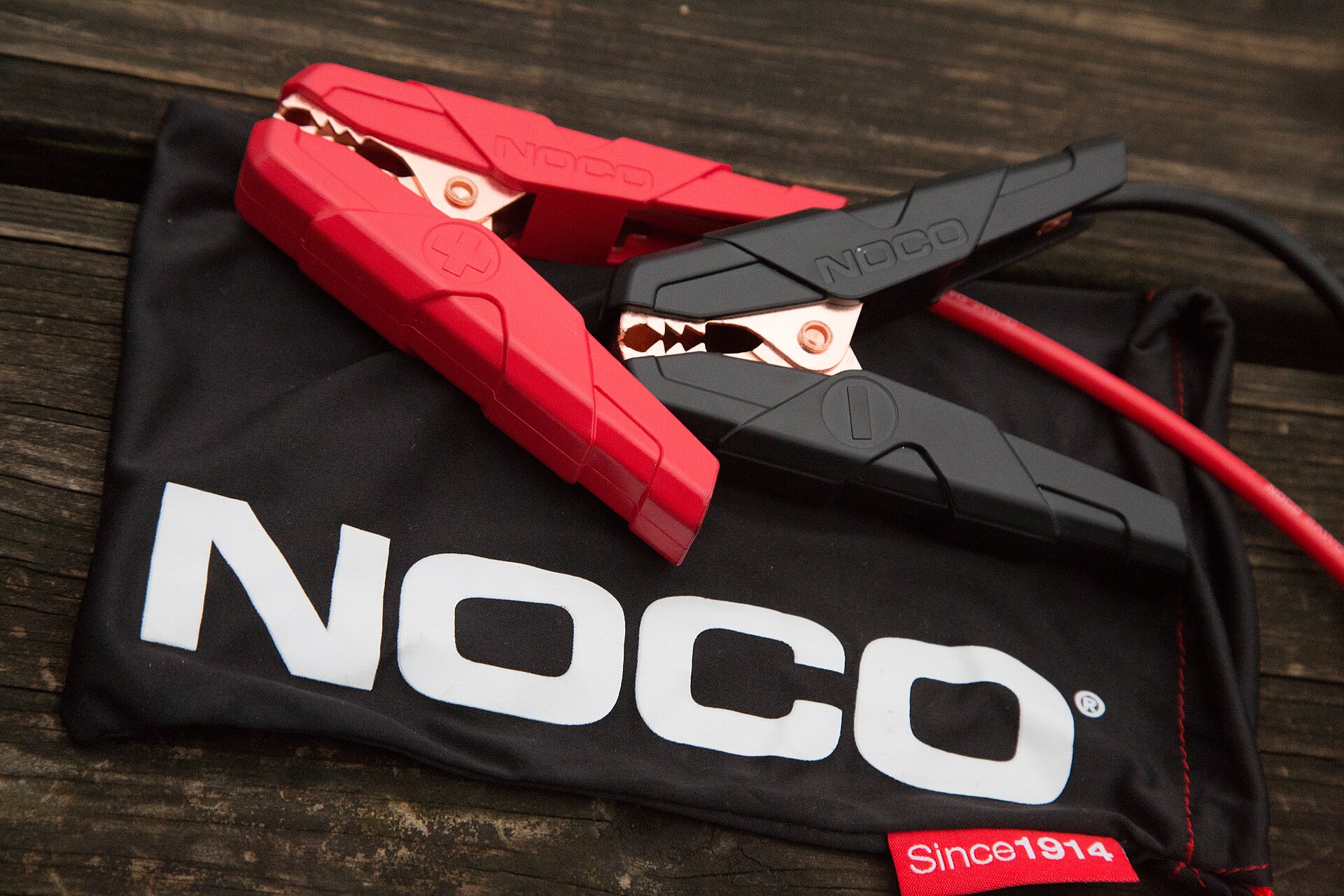 Jump starter clamps and cable for connecting to a car battery, an important part of choosing the best car jump starter under £100
