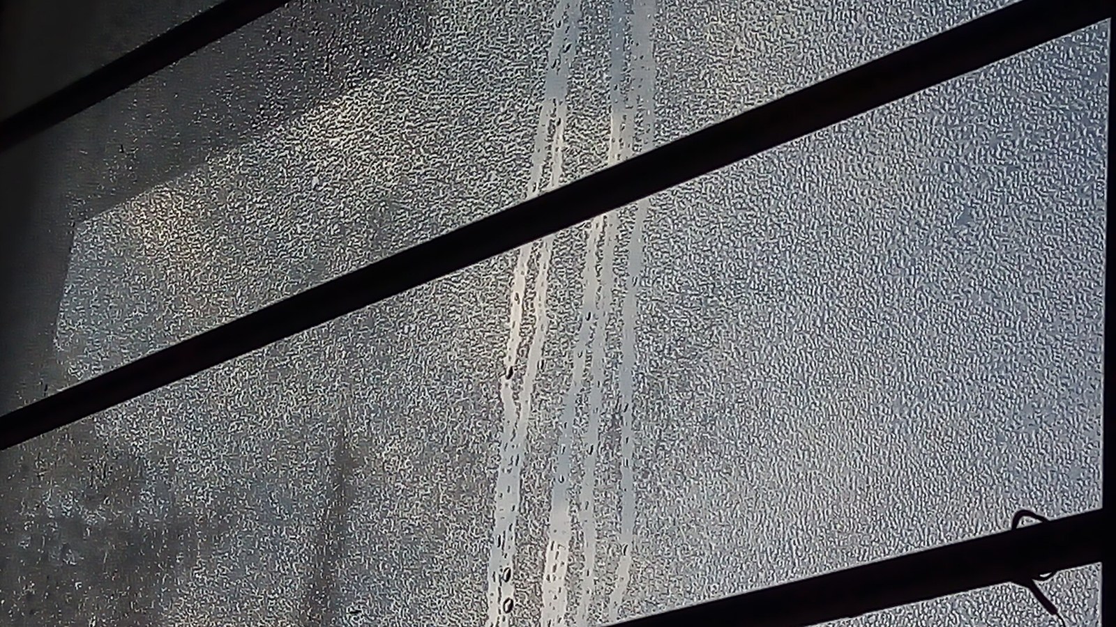 Window covered in condensation, the problem the best dehumidifier for drying clothes also solves