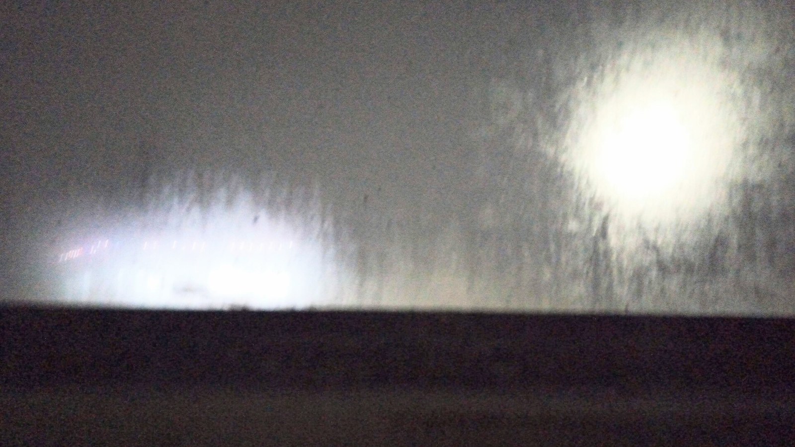 Condensation on a window at night, a typical winter damp problem in UK homes