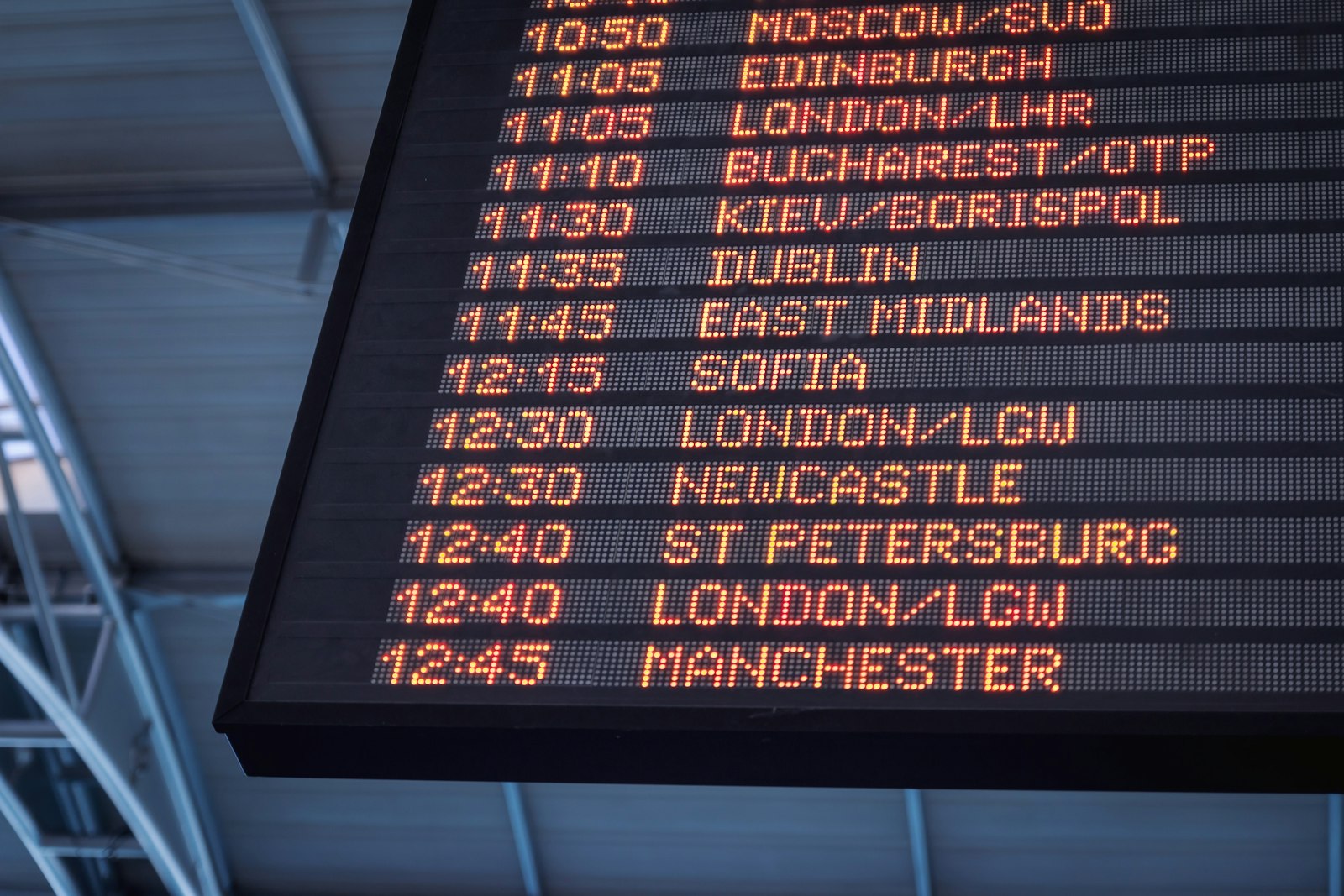 Airport departures board showing flights from London Heathrow and Gatwick to European cities