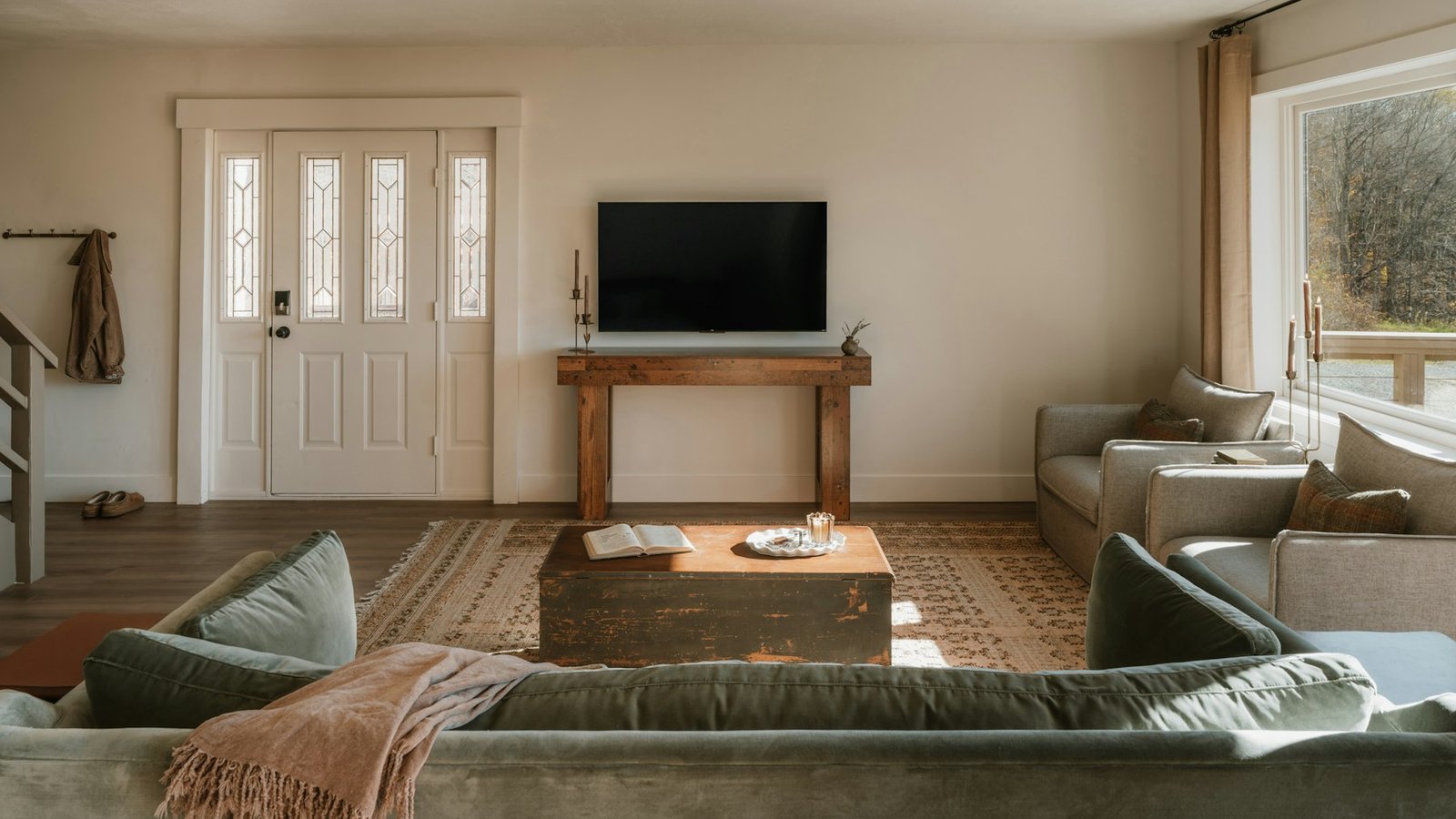 Cosy living room with sofas and a television, where Britain watches Celebrity Traitors series 2 twice a week