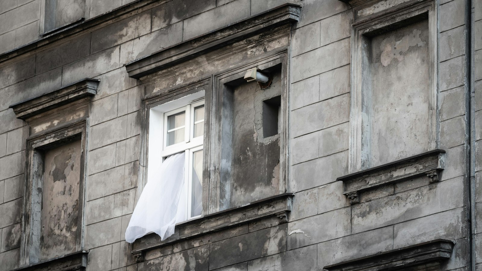 An open window in an old building, a reminder that draughts cost more than standby