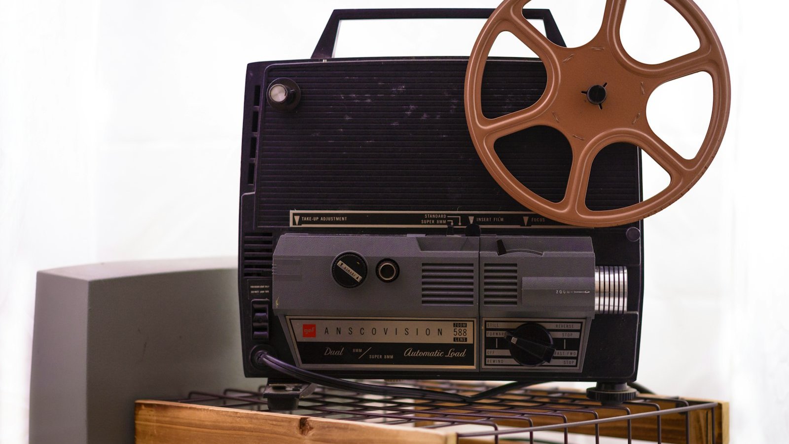 Vintage film projector with a reel, a nod to Halloween film screenings London 2026 programmes of classic horror