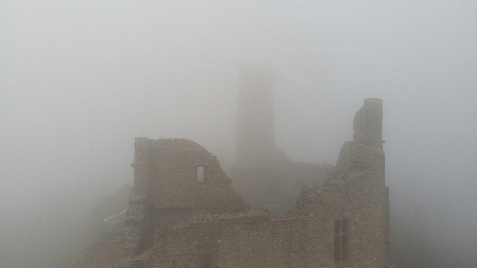 Fog-covered ruined castle tower, the Gothic mood of Hammer's restored Dracula