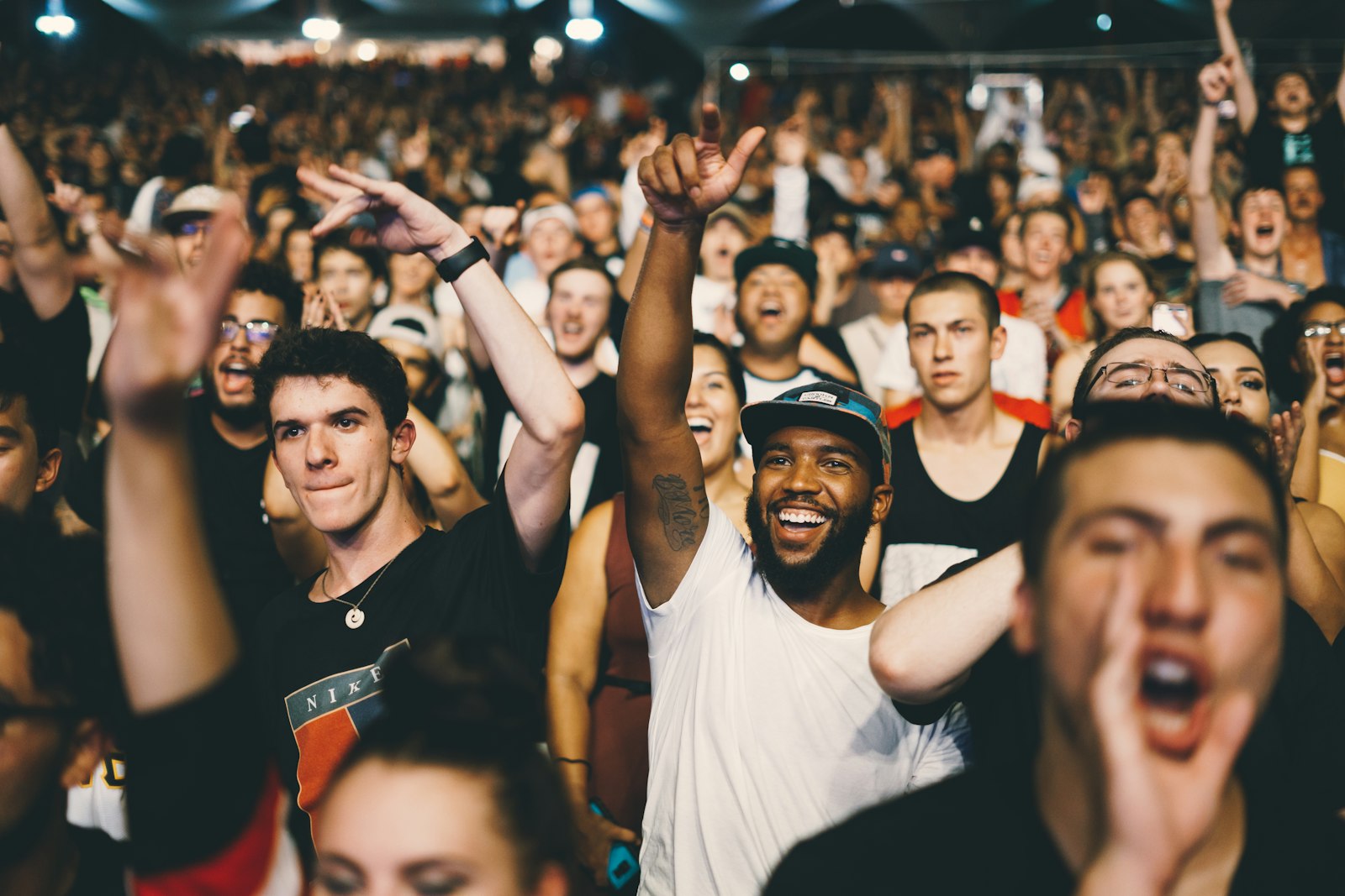 Crowd with hands raised at an arena show, the kind of night Hear'Say Liberty X tour tickets 2027 are aiming to fill