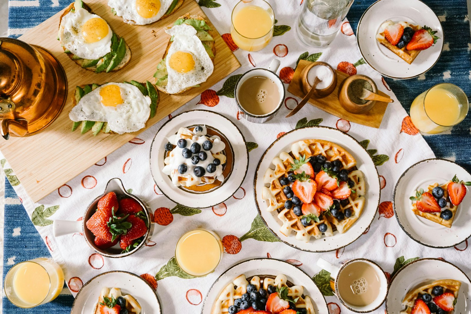 Breakfast spread of waffles, eggs and juice, the meal many people skip when trying intermittent fasting for weight loss