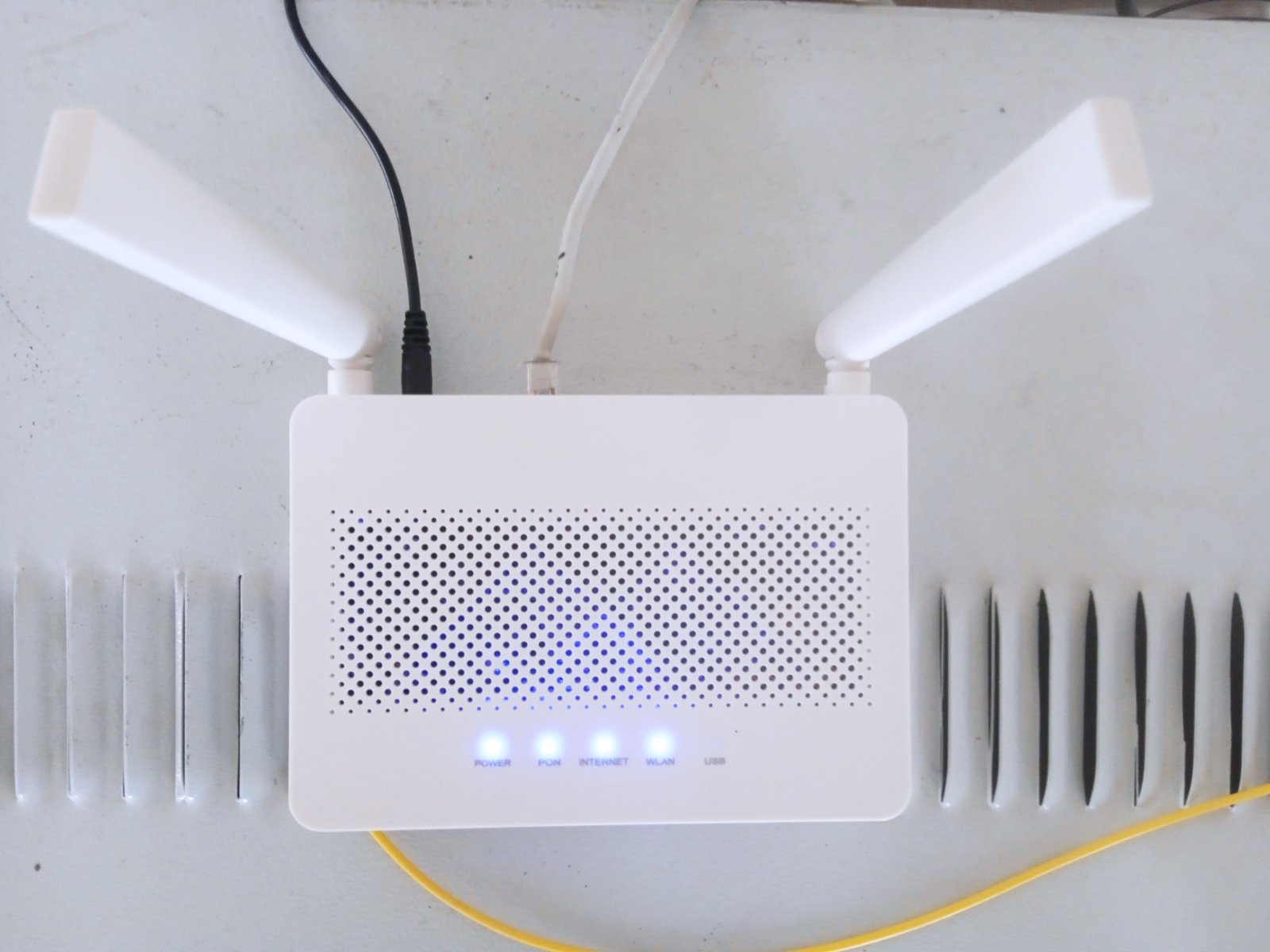 A home Wi-Fi router on a shelf, the first thing to move before choosing mesh wifi vs extender