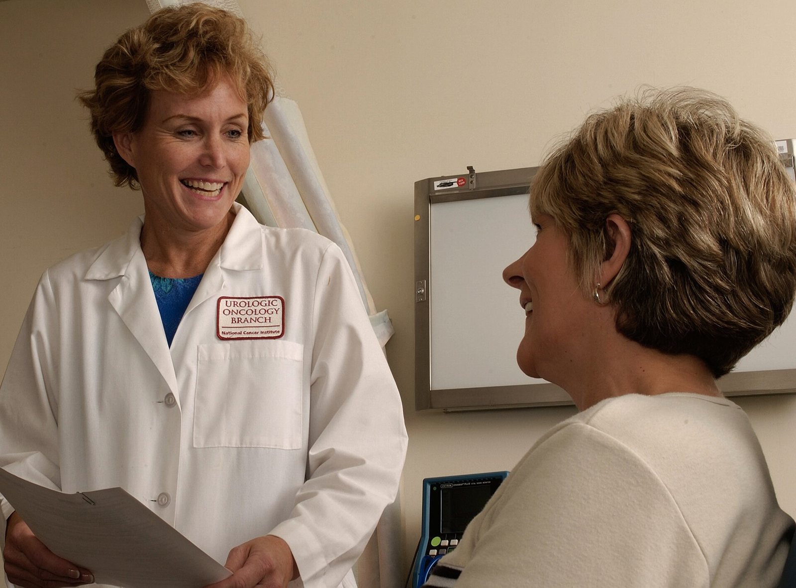 Doctor talking with a patient, a GP chat is the next step if a weighted blanket for sleep does not fix insomnia