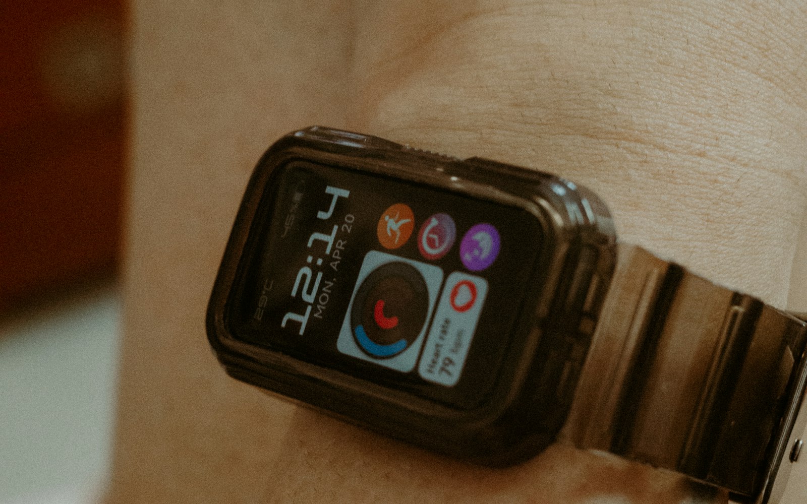 Smartwatch on a wrist showing heart rate, the kind of tracker used to monitor zone 2 cardio